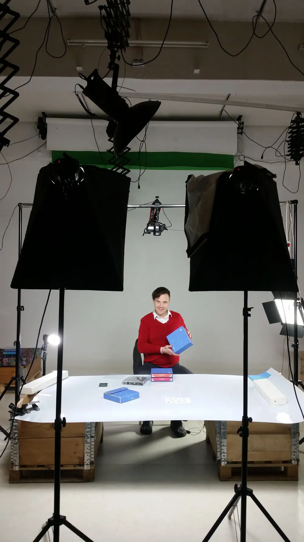 Product photography table with softboxes and camera rig mid-setup